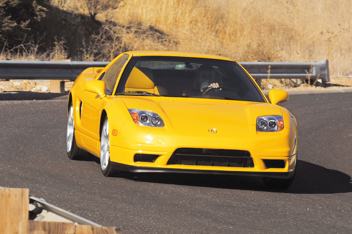 Yellow Acura NSX on road, front view